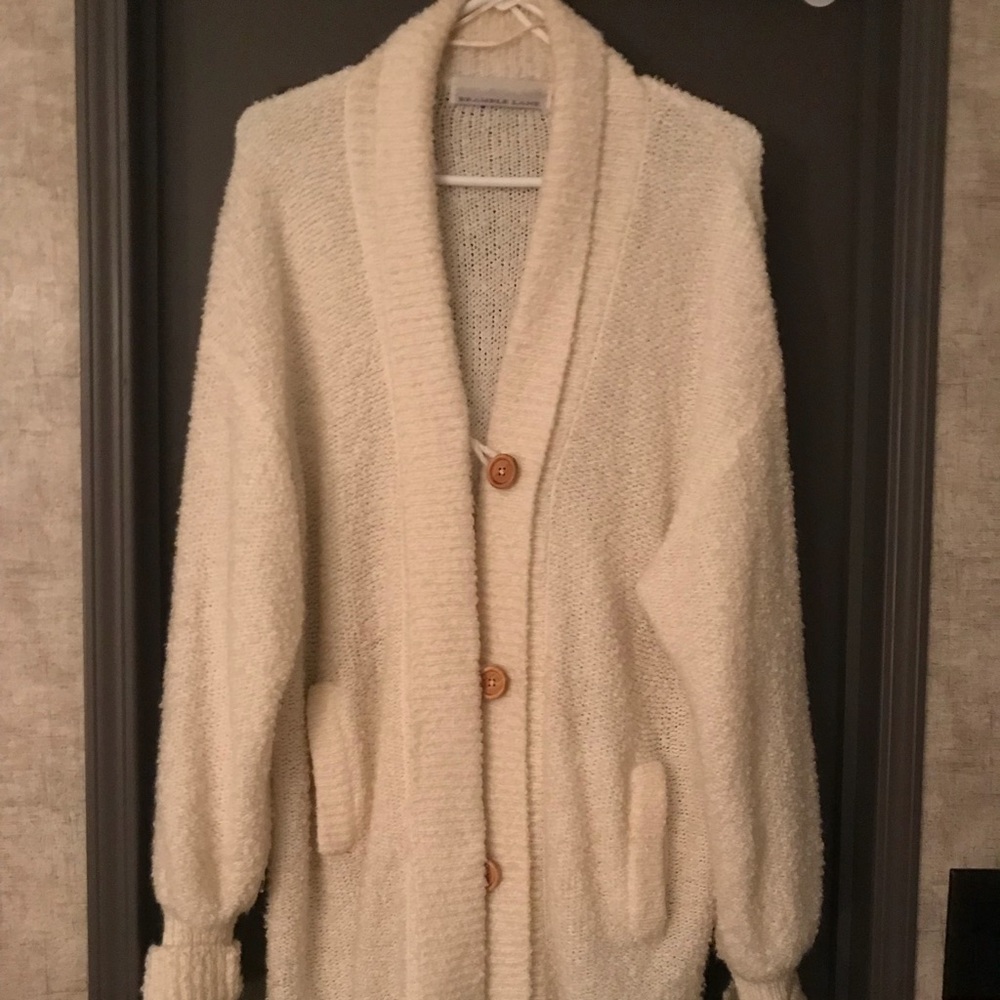 Cream cardigan, size medium, not true to size.